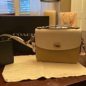 Beige Coach satchel